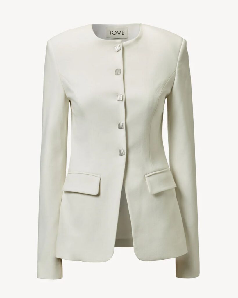 Cream collarless blazer with buttons and front pockets
