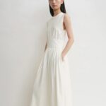 White sleeveless midi dress with a gathered waist