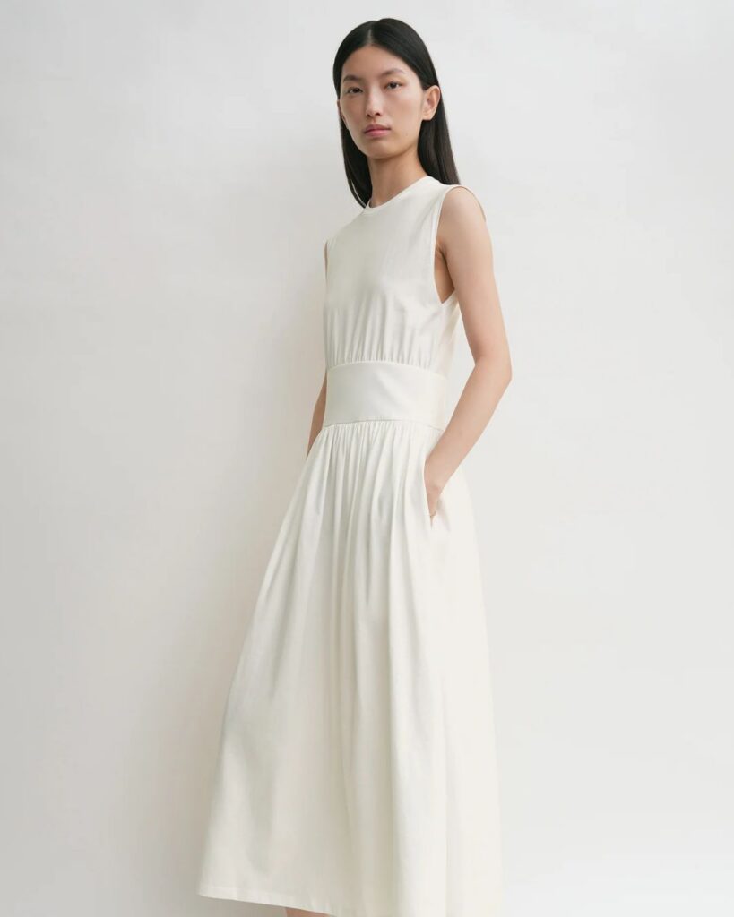 White sleeveless midi dress with a gathered waist