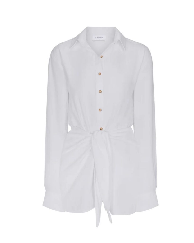 White button-front shirt dress with long sleeves and a tie waist