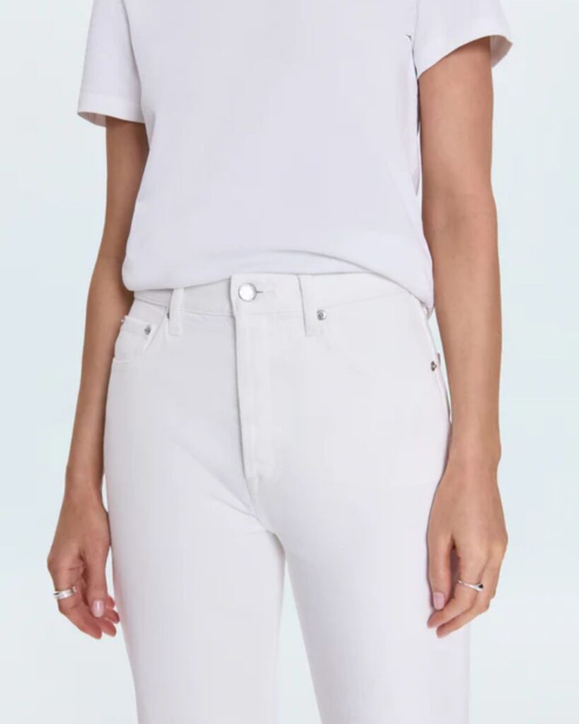 White T-shirt styled with high-rise white jeans