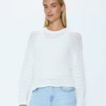 White open-knit sweater for a light capsule wardrobe