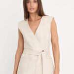 Cream sleeveless wrap top styled for a capsule wardrobe