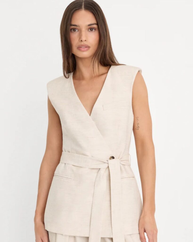 Cream sleeveless wrap top styled for a capsule wardrobe