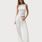 White sleeveless top and matching pants for a chic summer outfit