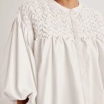 White embroidered blouse with gathered sleeves