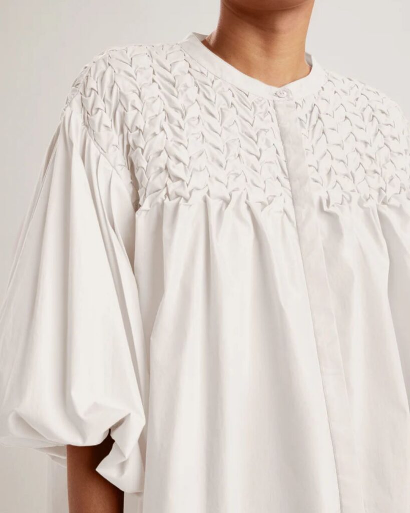 White embroidered blouse with gathered sleeves